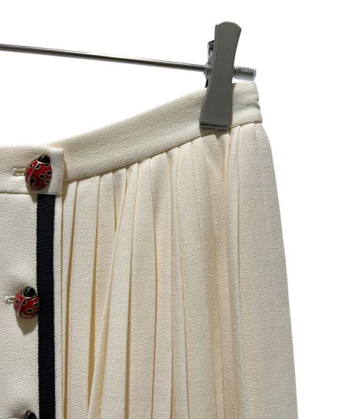 GUCCI（グッチ）GUCCI (グッチ) Pleated Skirt Ladybug Long Ivory/プリーツラップスカート てんとう虫 /523510 ZLW01 アイボリー サイズ:44の古着・服飾アイテム