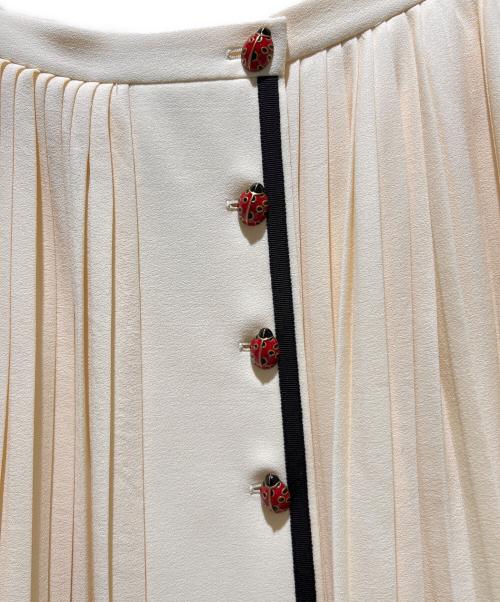GUCCI（グッチ）GUCCI (グッチ) Pleated Skirt Ladybug Long Ivory/プリーツラップスカート てんとう虫 /523510 ZLW01 アイボリー サイズ:44の古着・服飾アイテム