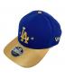 New Era（ニューエラ）の古着「ゴールドコレクションキャップ」｜ゴールド×ネイビー