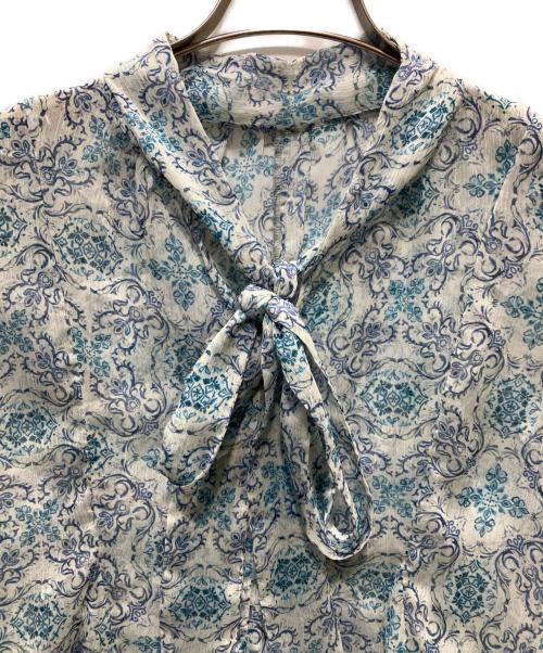 stola.（ストラ）stola. (ストラ) プリントボウタイブラウス ブルー サイズ:36の古着・服飾アイテム