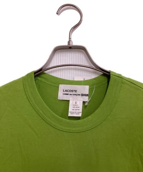 LACOSTE（ラコステ）LACOSTE (ラコステ) COMME des GARCONS SHIRT (コムデギャルソンシャツ) 変形TEE グリーン サイズ:S 未使用品の古着・服飾アイテム