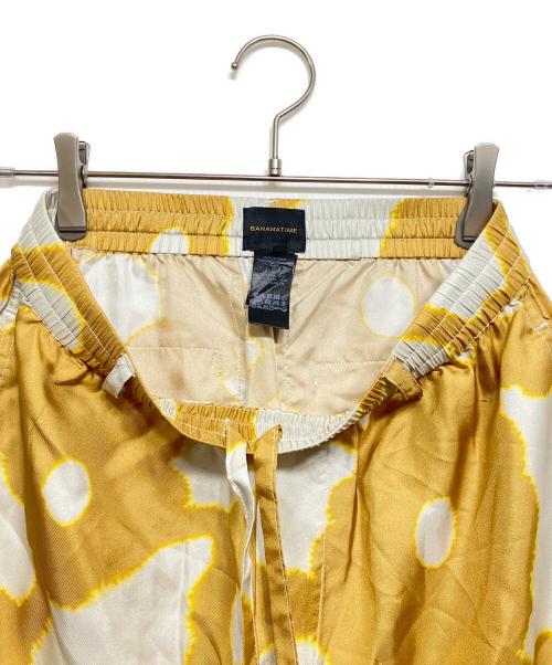 BANANATIME（バナナタイム）BANANATIME (バナナタイム) 総柄テーパードパンツ オレンジ×ホワイト サイズ:Sの古着・服飾アイテム