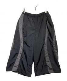 COOTIE PRODUCTIONS（クーティープロダクツ）の古着「Nylon Paneling Shin Cut Wide Track Pants」｜ブラック×グレー