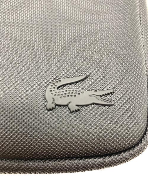 LACOSTE（ラコステ）LACOSTE (ラコステ) バーティカルカメラバッグ ブラックの古着・服飾アイテム