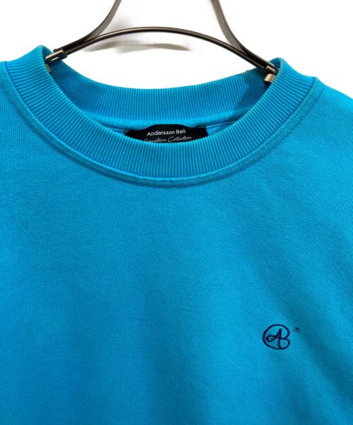 ANDERSSON BELL（アンダーソンベル）andersson bell (アンダーソンベル) SIGNATURE EMBLEM HEAVY SWEATSHIRT スカイブルー サイズ:	SIZE Lの古着・服飾アイテム