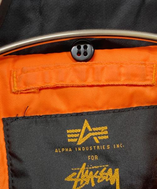 stussy（ステューシー）stussy (ステューシー) ALPHA INDUSTRIES (アルファインダストリーズ) B-15 Worldwide Jacket ブラック サイズ:Mの古着・服飾アイテム