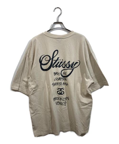 stussy（ステューシー）stussy (ステューシー) WORLD TOUR TEE ベージュ サイズ:SIZE XLの古着・服飾アイテム