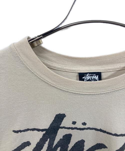 stussy（ステューシー）stussy (ステューシー) WORLD TOUR TEE ベージュ サイズ:SIZE XLの古着・服飾アイテム