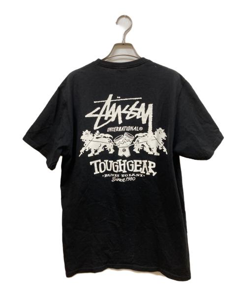 stussy（ステューシー）stussy (ステューシー) TOUGHGEAR プリントＴシャツ ブラック サイズ:Mの古着・服飾アイテム