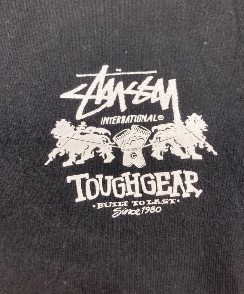 stussy（ステューシー）stussy (ステューシー) TOUGHGEAR プリントＴシャツ ブラック サイズ:Mの古着・服飾アイテム