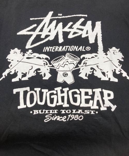 stussy（ステューシー）stussy (ステューシー) TOUGHGEAR プリントＴシャツ ブラック サイズ:Mの古着・服飾アイテム