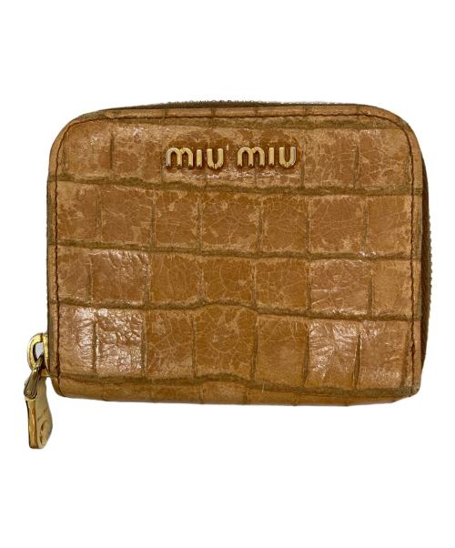MIU MIU（ミュウミュウ）MIU MIU (ミュウミュウ) 型押しラウンドジップウォレット ベージュの古着・服飾アイテム