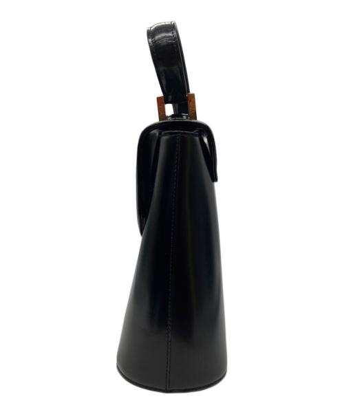 Yves Saint Laurent（イヴサンローラン）Yves Saint Laurent (イヴサンローラン) ロゴチャーム付きハンドバッグ ブラックの古着・服飾アイテム