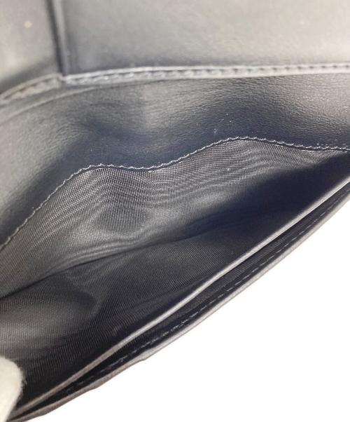TOD'S（トッズ）TOD'S (トッズ) 長財布　Tタイムレス ブラックの古着・服飾アイテム