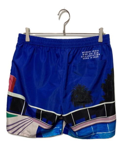 WIND AND SEA（ウィンダンシー）WIND AND SEA (ウィンダンシー) 永井 博 (Hiroshi Nagai) ショートパンツ ブルー サイズ:Lの古着・服飾アイテム