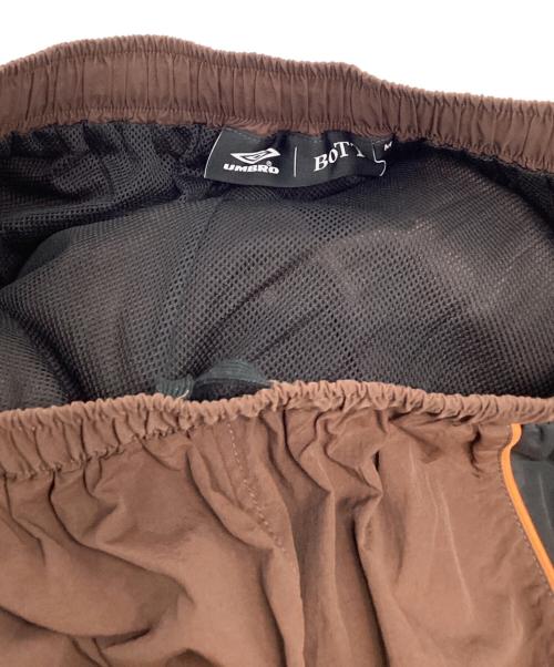 BoTT（ボット）BoTT (ボット) UMBRO (アンブロ) BEAMS T (ビームス ティー) ナイロンパンツ ブラウン サイズ:Mの古着・服飾アイテム
