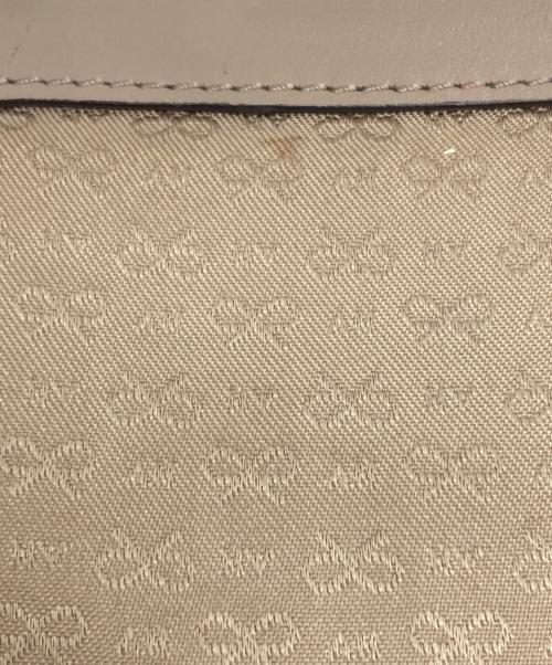 ANYA HINDMARCH（アニヤ・ハインドマーチ）ANYA HINDMARCH (アニヤ・ハインドマーチ) マキシジップ2WAYバッグ ベージュの古着・服飾アイテム