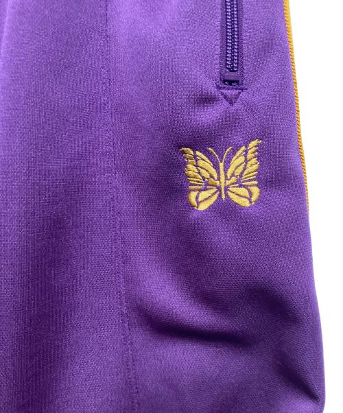 Needles（ニードルズ）Needles (ニードルズ) ヒザデルトラックパンツ パープル×イエロー サイズ:Mの古着・服飾アイテム