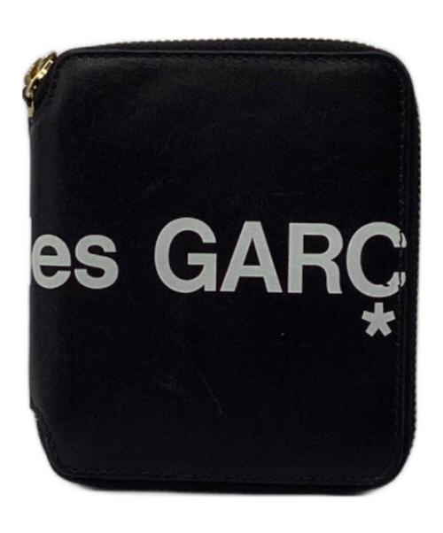 COMME des GARCONS（コムデギャルソン）COMME des GARCONS (コムデギャルソン) ヒュージロゴラウンドジップウォレット ブラックの古着・服飾アイテム