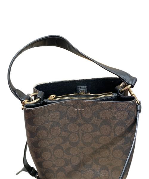 COACH（コーチ）COACH (コーチ) スモール タウン バケット バッグ シグネチャー キャンバス ブラウンの古着・服飾アイテム