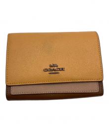 COACH（コーチ）の古着「2つ折り財布」｜イエロー×ブラウン