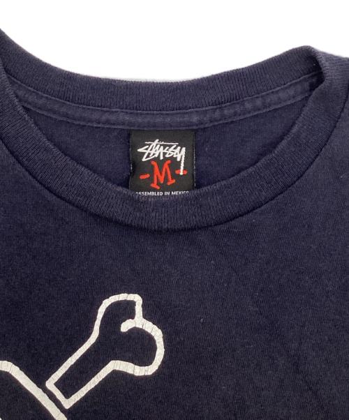 stussy（ステューシー）stussy (ステューシー) スカルクラウンetcTEE/プリントTシャツ ネイビー サイズ:Mの古着・服飾アイテム