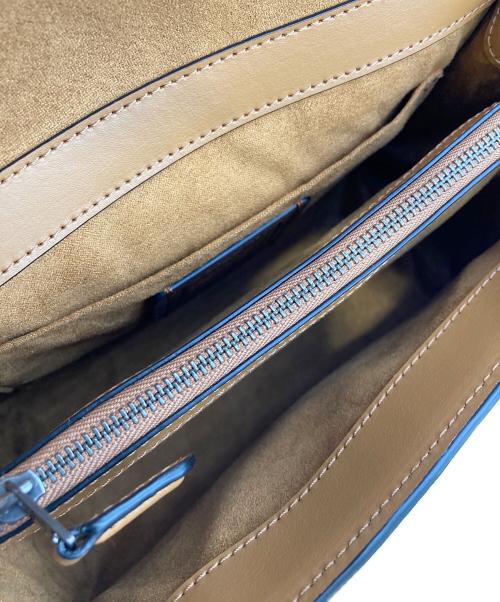 COACH（コーチ）COACH (コーチ) レザー ティリー トップ ハンドル ターンロック クロスボディ 2WAYバッグ ホワイト×ネイビーの古着・服飾アイテム