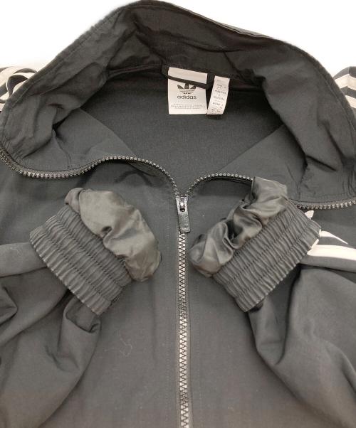 adidas（アディダス）adidas (アディダス) アディカラー ウーブン ファイヤーバード トラックトップ ブラック サイズ:XLの古着・服飾アイテム