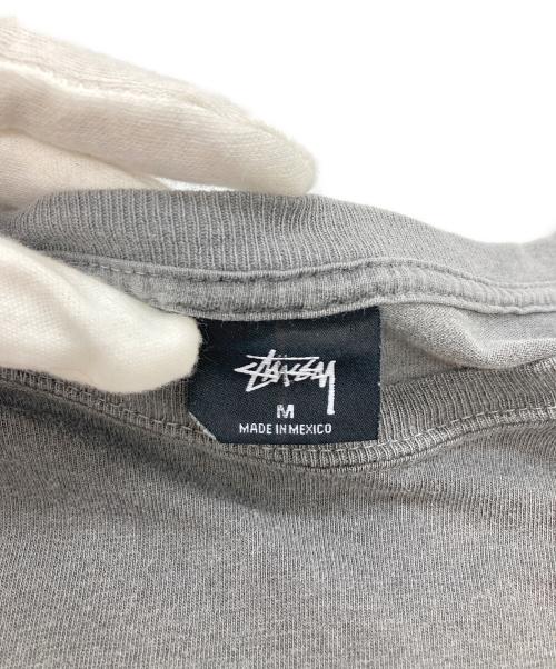 stussy（ステューシー）stussy (ステューシー) WORLD TOUR L/S TEE グレー サイズ:Mの古着・服飾アイテム