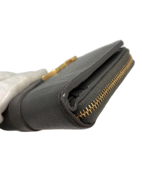 Yves Saint Laurent（イヴサンローラン）Yves Saint Laurent (イヴサンローラン) 2つ折り財布 グレーの古着・服飾アイテム