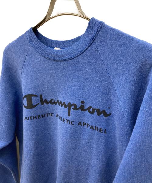 Champion（チャンピオン）Champion (チャンピオン) ラグラン染み込みプリントスウェット ブルー サイズ:Lの古着・服飾アイテム