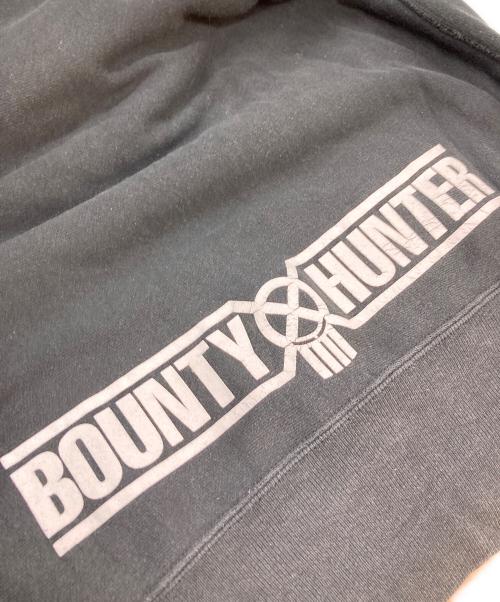 Champion（チャンピオン）Champion (チャンピオン) BOUNTY HUNTER (バウンティハンター) プリントパーカー ブラック サイズ:XLの古着・服飾アイテム