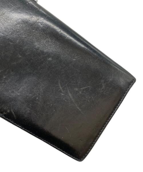 ISAMU KATAYAMA BACKLASH（イサムカタヤマ・バックラッシュ）ISAMU KATAYAMA BACKLASH (イサムカタヤマ・バックラッシュ) 2つ折り財布 ブラックの古着・服飾アイテム
