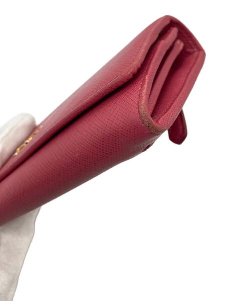 PRADA（プラダ）PRADA (プラダ) ロゴプレートフラップロングウォレット ピンクの古着・服飾アイテム