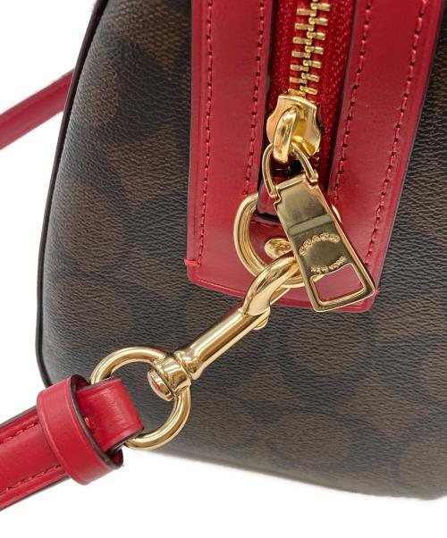 COACH（コーチ）COACH (コーチ) ローアンサッチェルシグネチャー ブラウン×レッドの古着・服飾アイテム