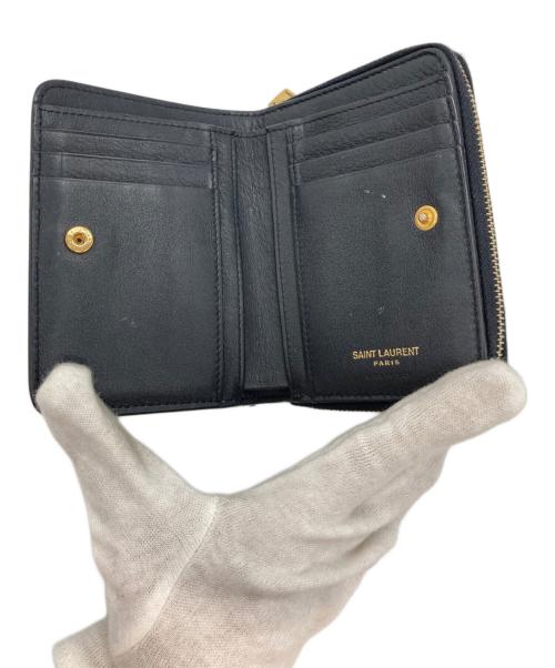 Saint Laurent Paris（サンローランパリ）Saint Laurent Paris (サンローランパリ) ロゴプレートコンパクトジップウォレット ブラックの古着・服飾アイテム