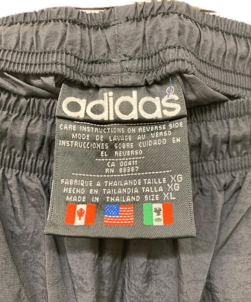 adidas（アディダス）adidas (アディダス) 80s ヴィンテージ万国旗トラックパンツ ブラック サイズ:XLの古着・服飾アイテム
