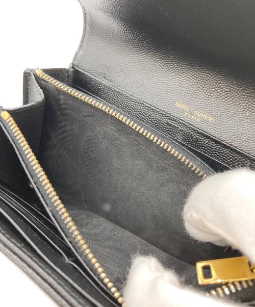 Yves Saint Laurent（イヴサンローラン）Yves Saint Laurent (イヴサンローラン) カサンドラ YSLロゴフラップロングウォレット ブラックの古着・服飾アイテム