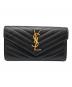 Yves Saint Laurent（イヴサンローラン）の古着「カサンドラ YSLロゴフラップロングウォレット」｜ブラック