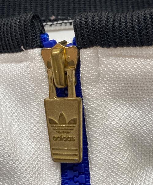 adidas（アディダス）adidas (アディダス) デサント期トレフォイルロゴ刺繍トラックジャケット ブルー×ホワイト サイズ:SIZEXOの古着・服飾アイテム