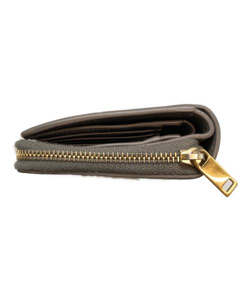 Saint Laurent Paris（サンローランパリ）Saint Laurent Paris (サンローランパリ) YSLロゴ レザー コンパクト ミニ ウォレット グレージュの古着・服飾アイテム