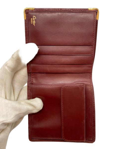 Cartier（カルティエ）Cartier (カルティエ) マストドゥカルティエ 2つ折り財布 ボルドーの古着・服飾アイテム