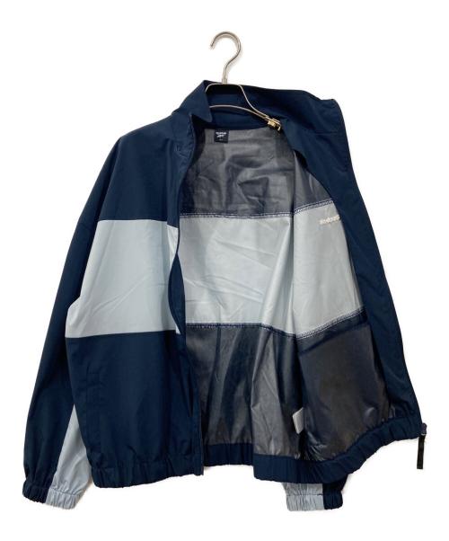REEBOK（リーボック）REEBOK (リーボック) ナイロンジャケット ブルー×ネイビー サイズ:Lの古着・服飾アイテム
