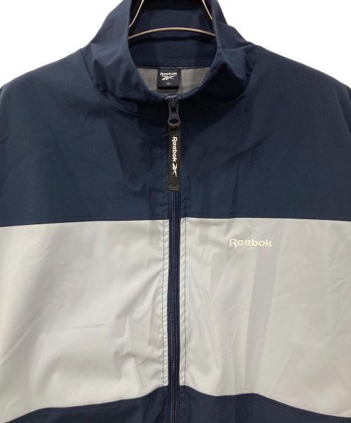 REEBOK（リーボック）REEBOK (リーボック) ナイロンジャケット ブルー×ネイビー サイズ:Lの古着・服飾アイテム