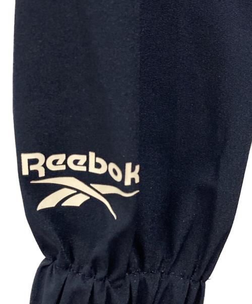 REEBOK（リーボック）REEBOK (リーボック) ナイロンジャケット ブルー×ネイビー サイズ:Lの古着・服飾アイテム