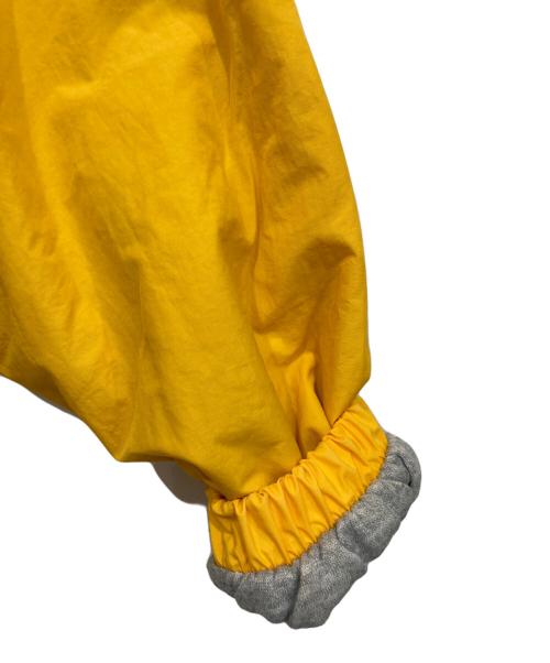 DISNEY（ディズニー）DISNEY (ディズニー) ナイロンフーデッドジャケット イエロー サイズ:Sの古着・服飾アイテム