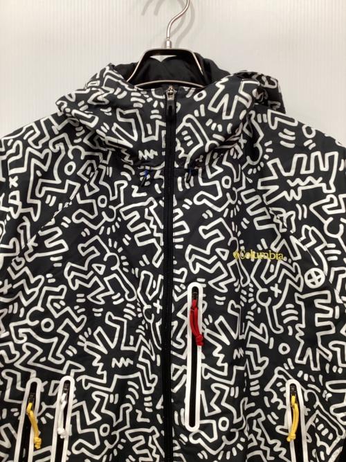 Columbia（コロンビア）Columbia (コロンビア) Kinetics (キネティックス) Keith Haring (キースヘリング) 総柄マウンテンパーカー グレー×ホワイト サイズ:Lの古着・服飾アイテム