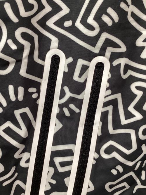 Columbia（コロンビア）Columbia (コロンビア) Kinetics (キネティックス) Keith Haring (キースヘリング) 総柄マウンテンパーカー グレー×ホワイト サイズ:Lの古着・服飾アイテム