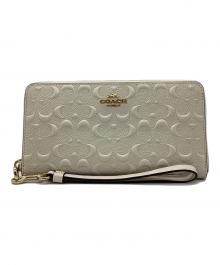 COACH（コーチ）の古着「ラウンドジップウォレット」｜アイボリー