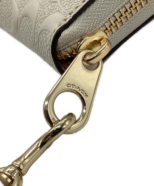 COACH（コーチ）COACH (コーチ) ラウンドジップウォレット アイボリーの古着・服飾アイテム